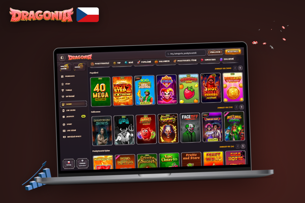 Notebook s betting logem a účtem Dragonia Casino na stole vedle šálku kávy
